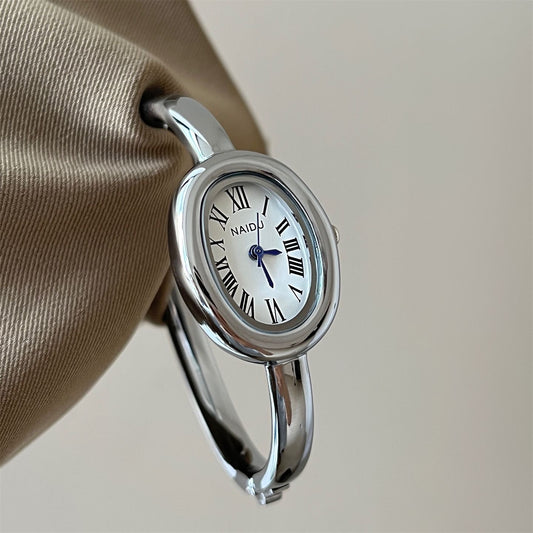 Vintage-Inspired Gold Oval Watch for Women Roman Numeral Dial Bangle Watch