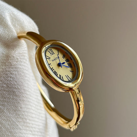 Vintage-Inspired Gold Oval Watch for Women Roman Numeral Dial Bangle Watch