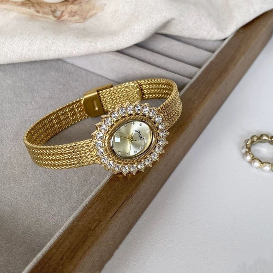 Retro-style oval dial gold/silver strap zircon watch